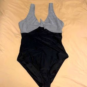 Size small navy and white bathing suit. Never been worn!! Very cute!!